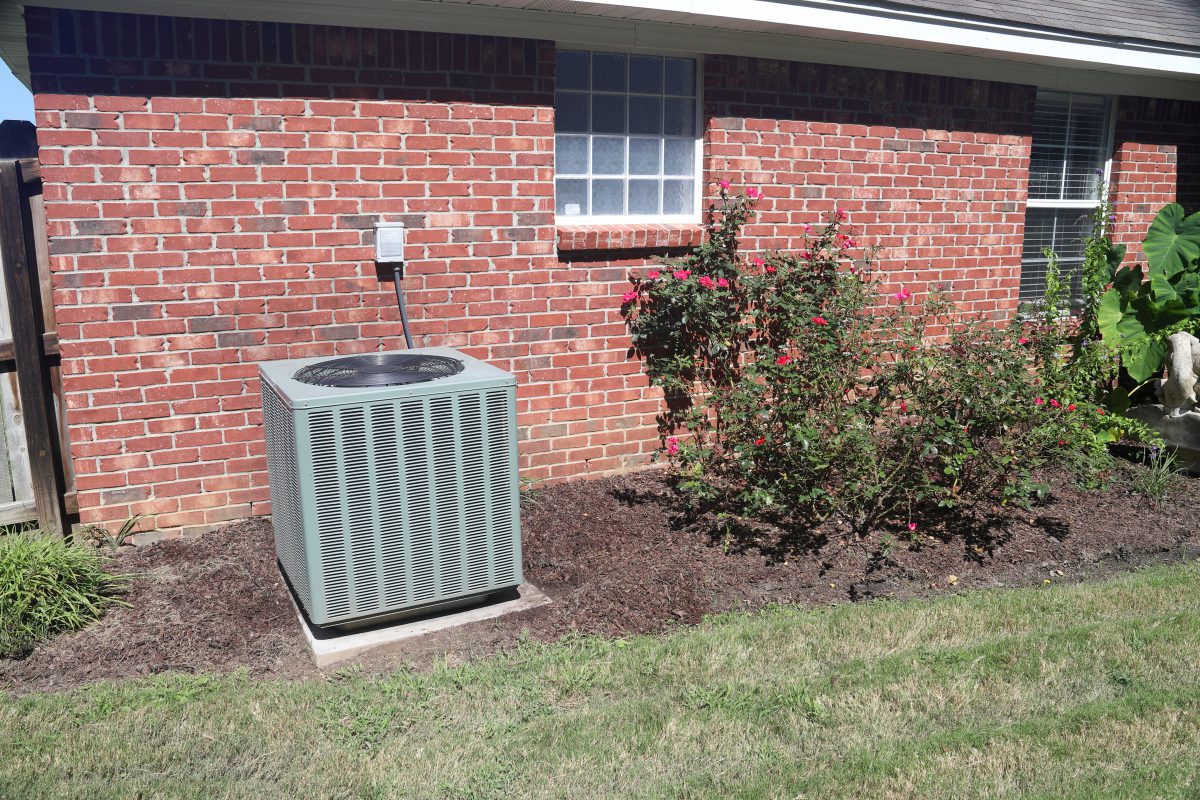 Air Conditioner system next to a home in Mt Vernon MO